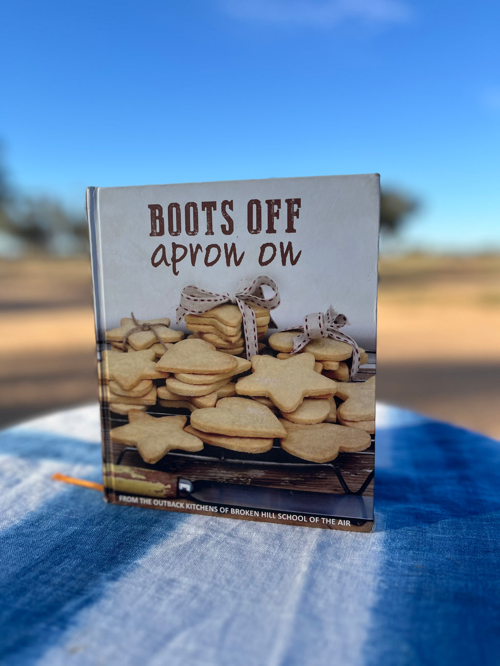 Limited edition BOOTS OFF apron on - single cookbook